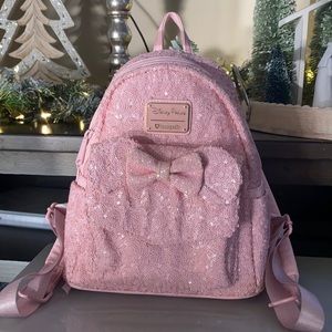 Gently used Disney parks baby pink sequin loungefly mini backpack
